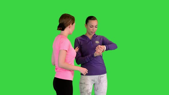 Two Young Women Talking and Running on a Green Screen Chroma Key