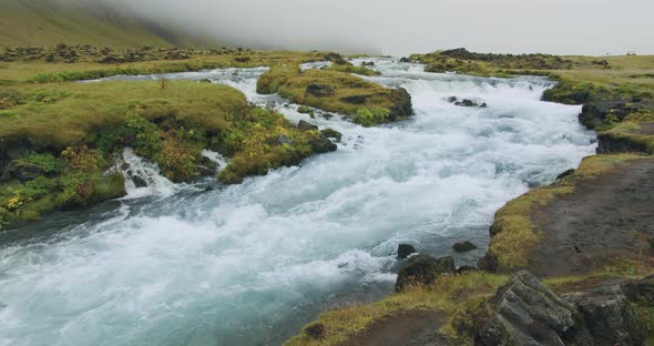 Blue Water in Mountain River with Cascades