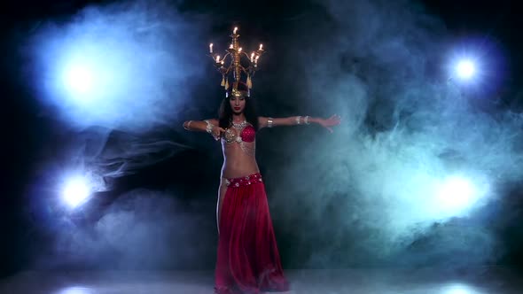 Attractive Belly Dancer Continue Dancing with Candles on Her Head, Black, Smoke