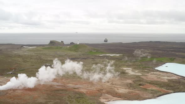 Aerial View Of Steaming Fumarole In Geothermal Area In Iceland - drone shot