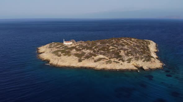 Copter Fly Around the Small Island with Old House Surrounded By Sea Space. Island with One House