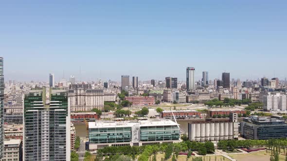 Aerial parallax shot of Puerto Madero waterfront and Buenos Aires government buildings