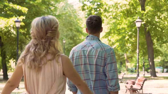 Loving Couple Gently Embracing, Enjoying Long-Awaited Date in Park, First Love