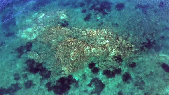 Small Islet Island Formed by the Accumulation of Rock Deposits Atop a Reef in the Sea