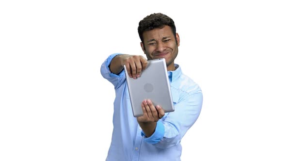 Happy Indian Man Playing Video Game on Tablet Pc