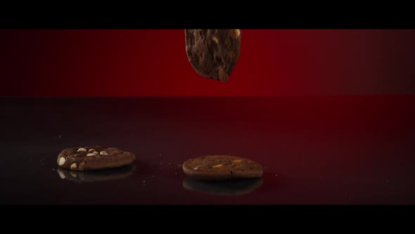 Falling cookies from above onto a reflective surface - COOKIES 200
