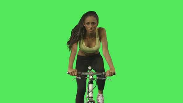 Female exercising on bicycle