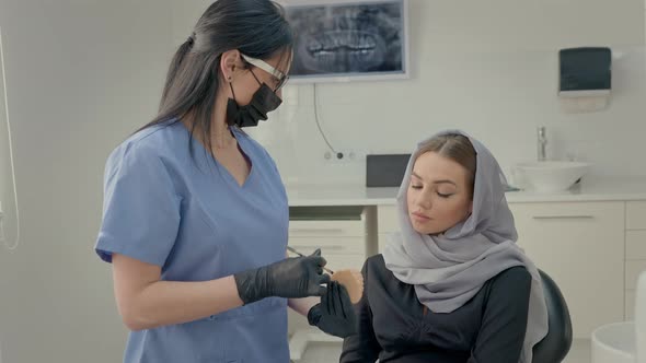 Dentist Working In Office