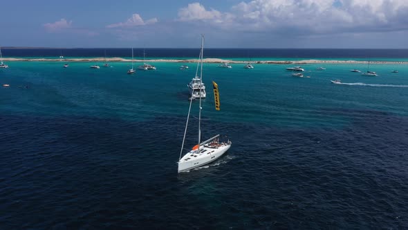 Yacht Sailing at Sunset During a Storm