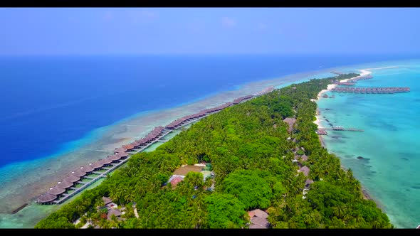 Aerial flying over landscape of tranquil sea view beach lifestyle by transparent sea with white sand