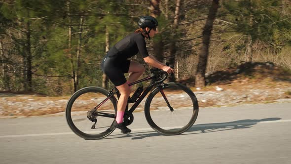 Cyclist on bike climbing up on mountain hill. Sport workout.