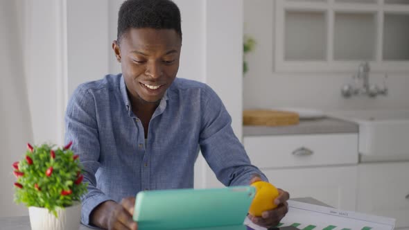 Genius Young African American Startuper Talking at Tablet Web Camera Smiling