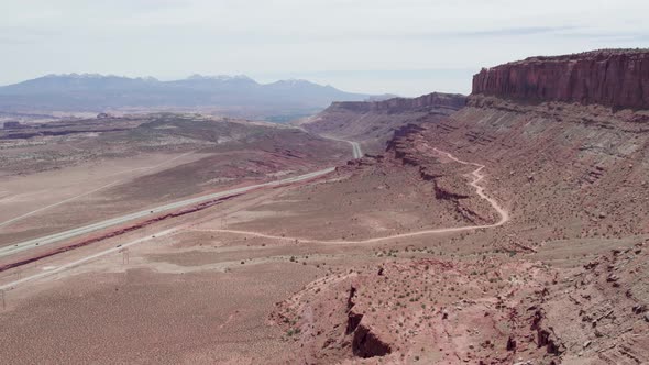 Panorama Of Desert Road With Scenic Red Sandstone Cliffs In Moab, Utah USA. Aerial Wide Shot