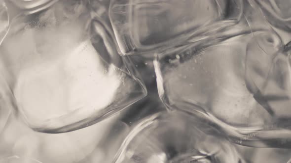 Closeup Ice Cubes Water Spinning Slow Motion