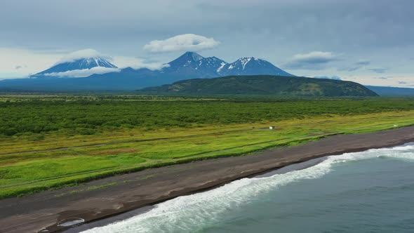 Beach with Black Sand and Volcano