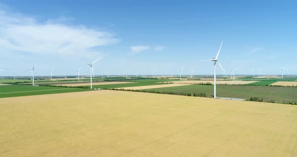 Group of windmills for electric power production in the agricultural fields, Aerial view