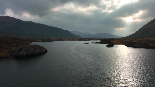 Killarney, Kerry, Ireland, March 2022. Drone pulls slowly above the water while facing southwest tow