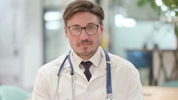 Portrait of Male Doctor Looking at the Camera