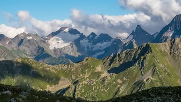 Puffy clouds over the mountains