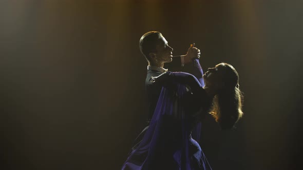 Light Waltz Movements Performed By Charming Pair of Ballroom Dancers