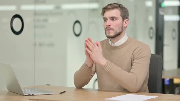 Creative Young Man Thinking in Office