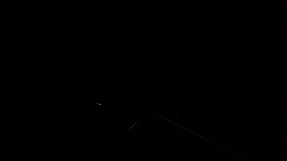 Time lapse of driving through the city at night