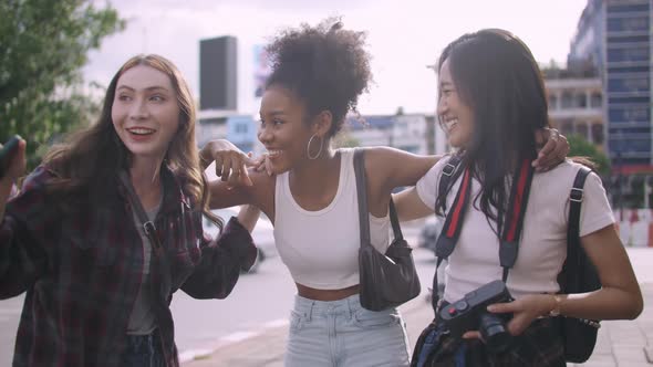 A group of multi-ethnic female friends enjoying the city tour.