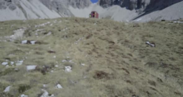 Aerial drone view of hikers hiking in the mountains.