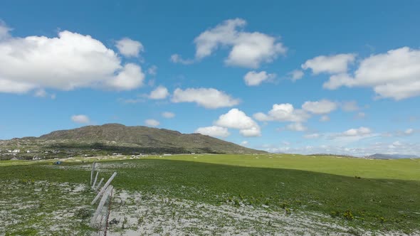 Motion Timelapse Of Fluffy White Clouds Moving In The Bright Blue Sky Over The Lush Mountain Near Do