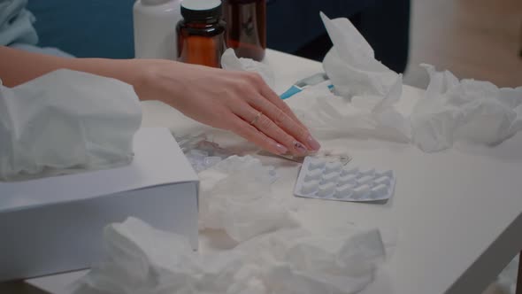 Close Up of Hand Holding Tablets with Capsules and Pills