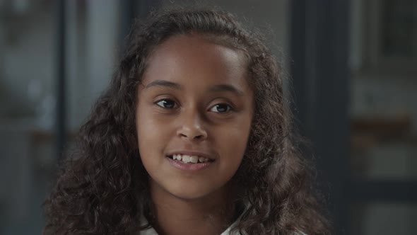 Charming Little Girl with Playful Smile Flirting alt