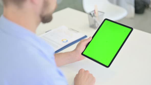 Young Creative Man Using Tablet with Chroma Screen