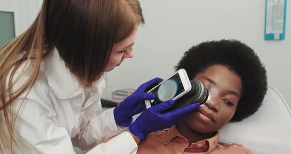 Dermatologist Examines A Skin