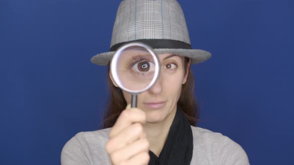 Funny Girl Looking Throw Magnifier To the Camera 