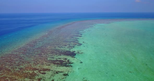 Tropical birds eye abstract shot of a white sand paradise beach and turquoise sea background in hi r