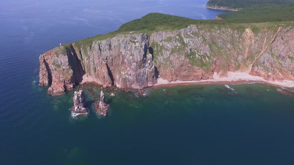 View From a Drone of the Coastline with a Rocky Coast Island of Shkot