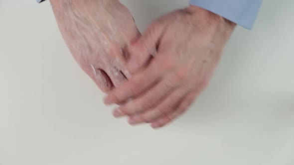 Closeup with Man's Hand Using Hand Cream to Care About Skin