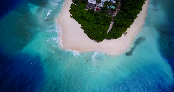 Natural above abstract shot of a sunshine white sandy paradise beach and turquoise sea background in