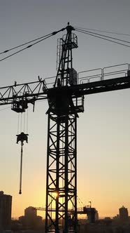 Construction Crane in the City at Sunrise