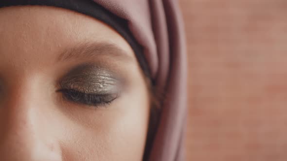 The Opening Eye of a Muslim Woman. Close Up of a Painted Muslim Eye Slowly Opens