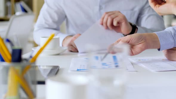 Business Team with Charts at Office Meeting