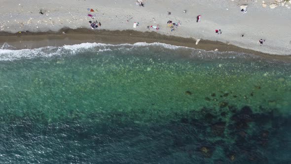 Aerial View From Above on Azure Sea and Volcanic Rocky Shores