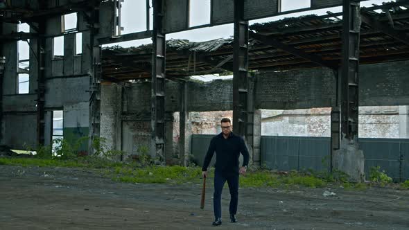 Bodybuilder with baseball bat. Brutal man bodybuilder with baseball bat