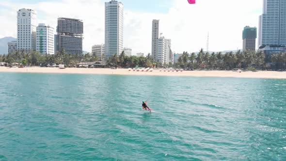 Aerial View of the City Beach and Active People Practicing Kite Surfing and Windsurfing. Kitesurfing