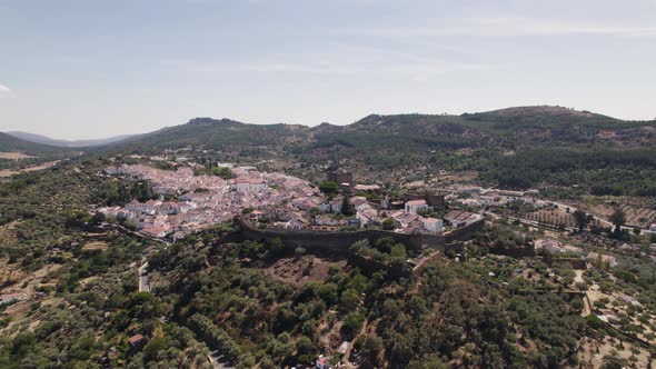 Aerial circle view over a valley with a perched village. Castelo de Vide. Portugal