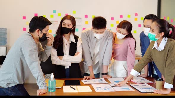 New normal group of Business man and woman wearing face mask meeting and working together