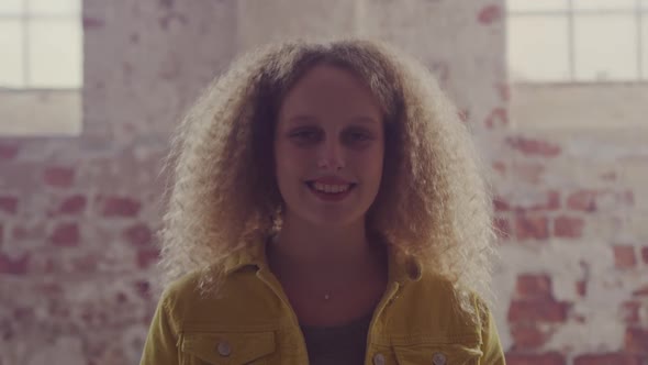 Fashionable young woman in an abandoned warehouse