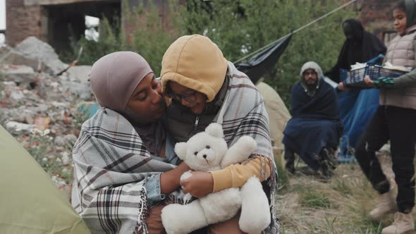 African American Mother and Daughter at Refugee Camp