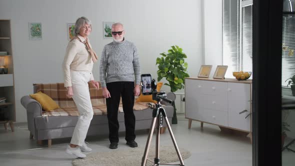 Seniors Hobbies Adorable Male and Female Retirees Having Fun Filming Social Media Video Content on a