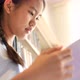 Asian teenager student reading a book in school library. - VideoHive Item for Sale